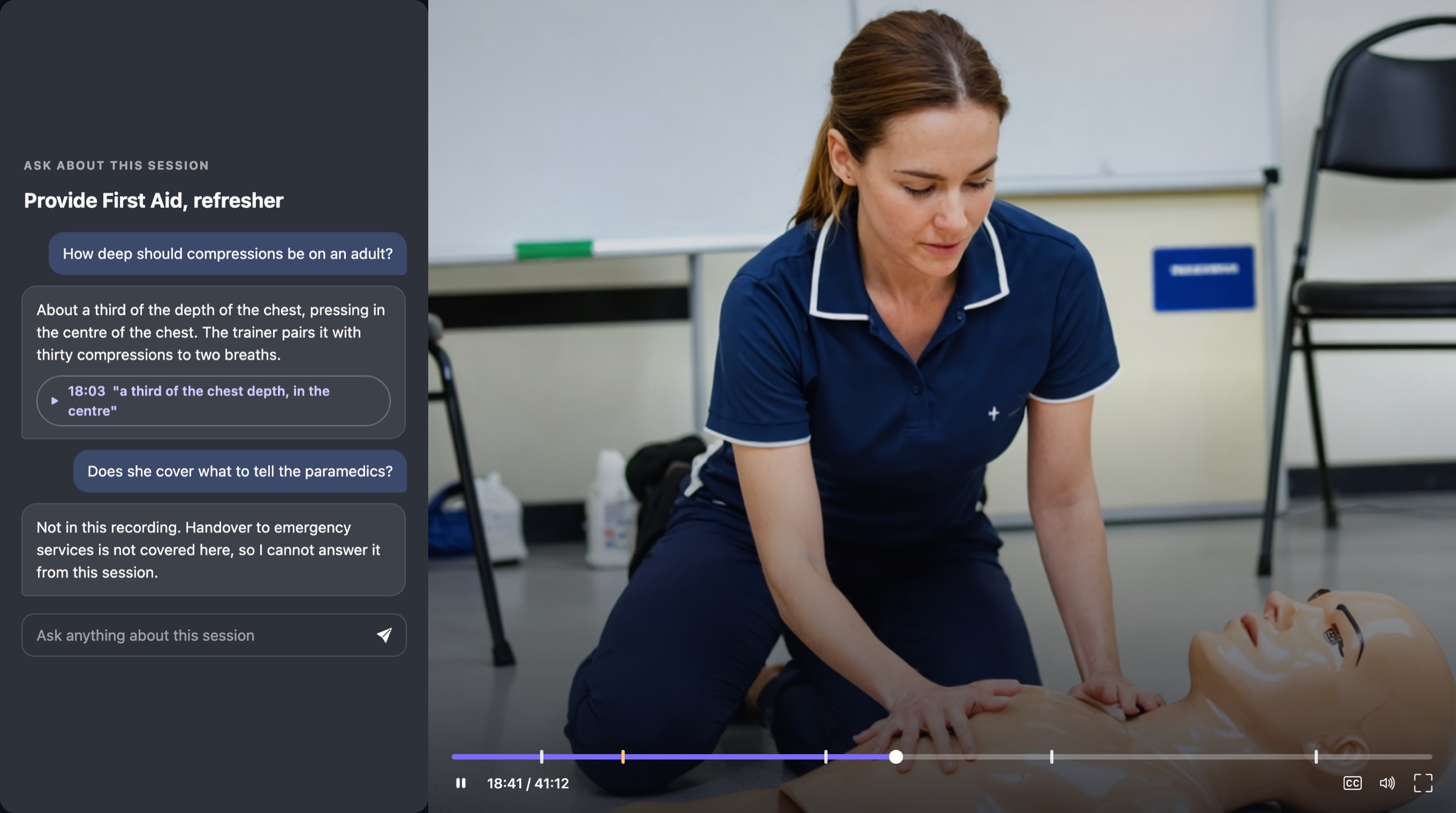 A learner asking the coach a question beside the video
